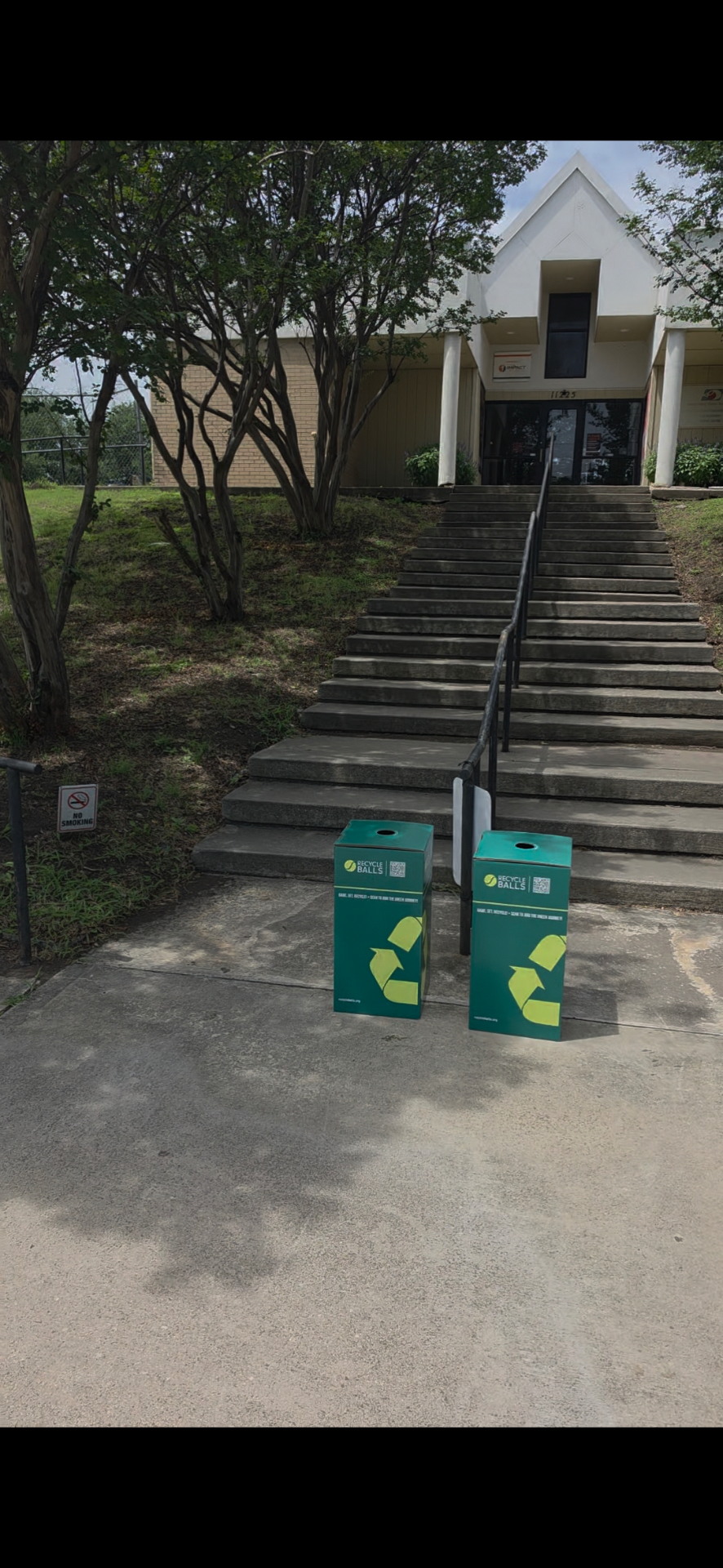 Two RecycleBalls bins placed in front of a Dallas rec center